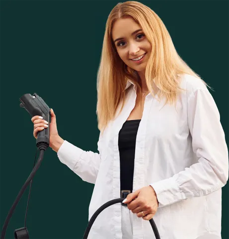 Woman holding an EV Charging Plug